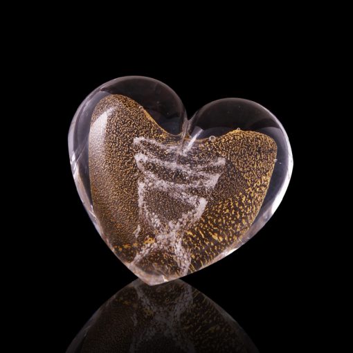 Minimalist black and white photo of a memorial glass crystal, light refracting through glass, artistic composition.
